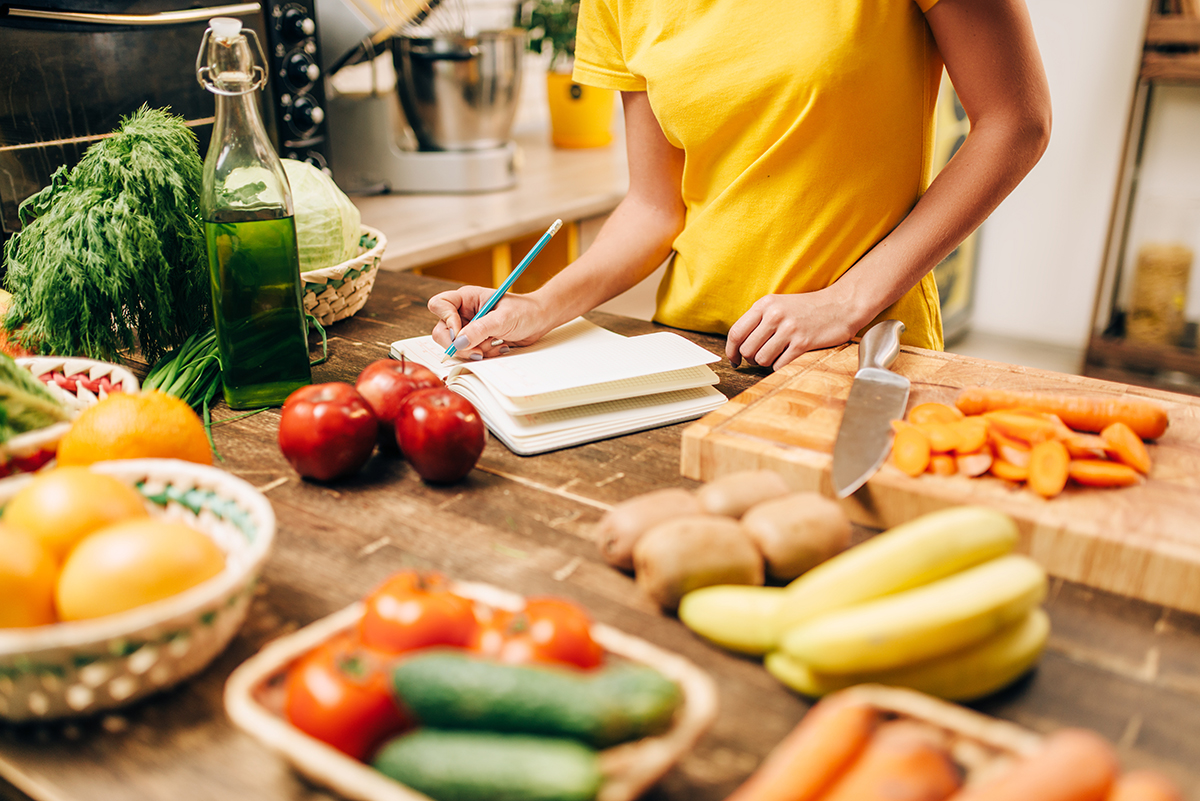 Female person cooking on the kitchen
