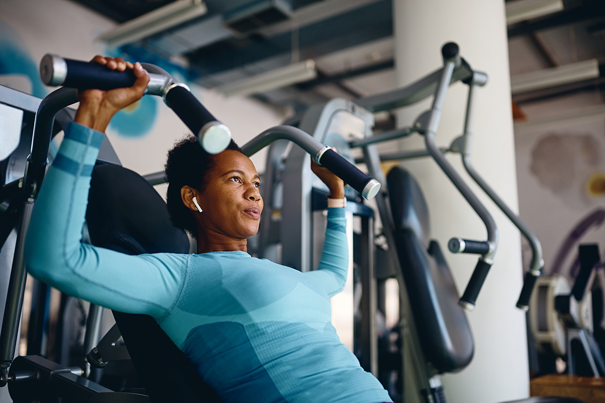 athletic woman using exercise machine