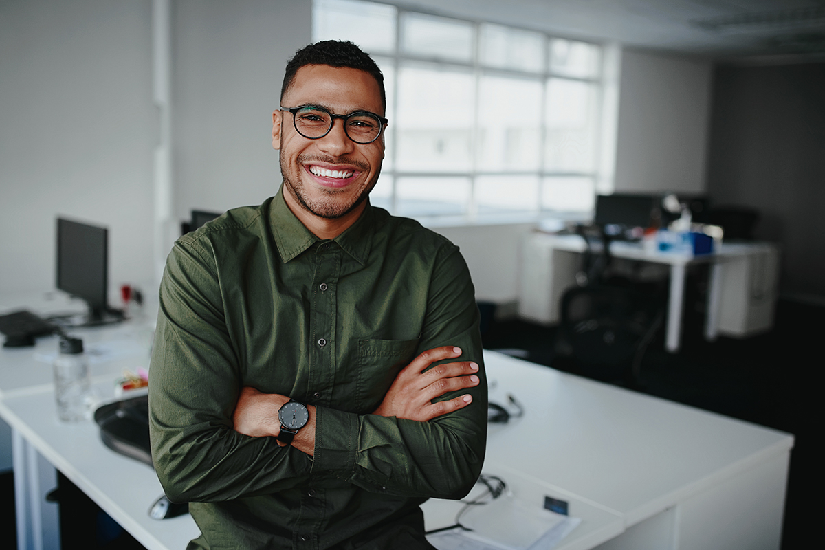 Businessman standing with his arms crossed looking at camera